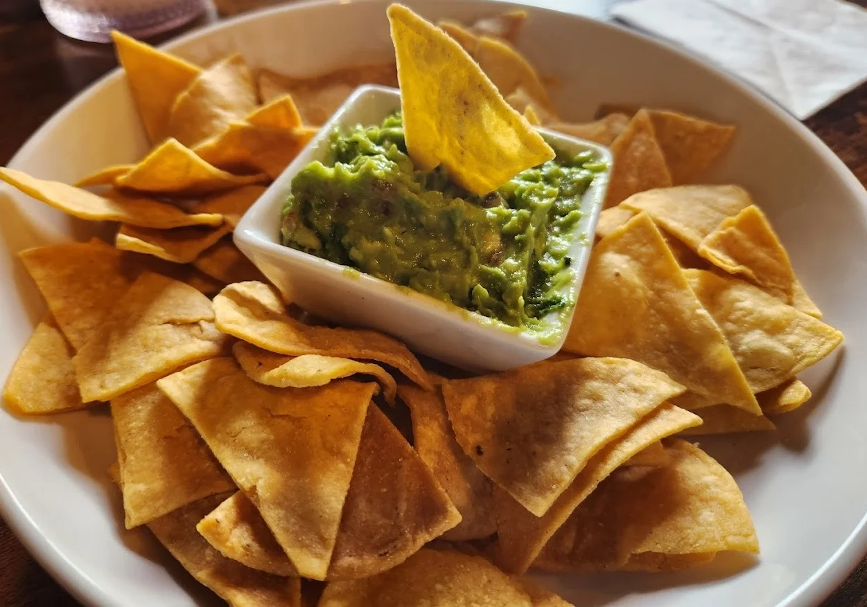 Nachos at Taqueria El Chingon Edmonton - homemade corn chips with nacho cheese and jalapenos